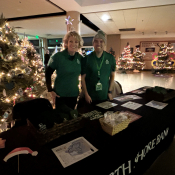 Talent Acquisition Manager Janet Rosenthal and Area Manager Ray Guardiola smile at the North Shore Bank table